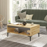 Table basse bois clair et gris ALIZÉ avec pieds noirs, intégrée dans une décoration moderne et lumineuse.